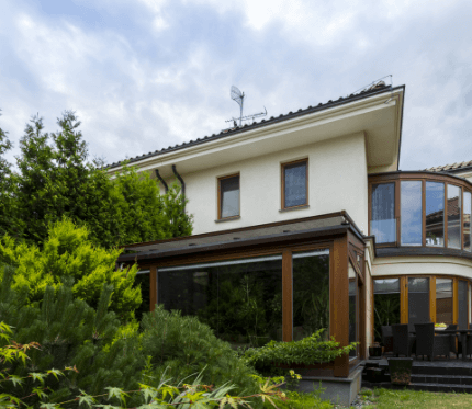 exterior-of-house-surrounded-by-lush-greenery-2024-10-22-05-34-38-utc
